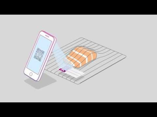 Smartphone scanning QR code on food packaging to get information about the food.