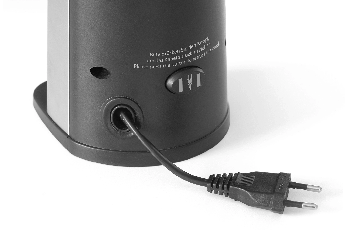 Netzkabel, das aus einem schwarzen Gerät herausragt, mit einem Stecker am Ende.