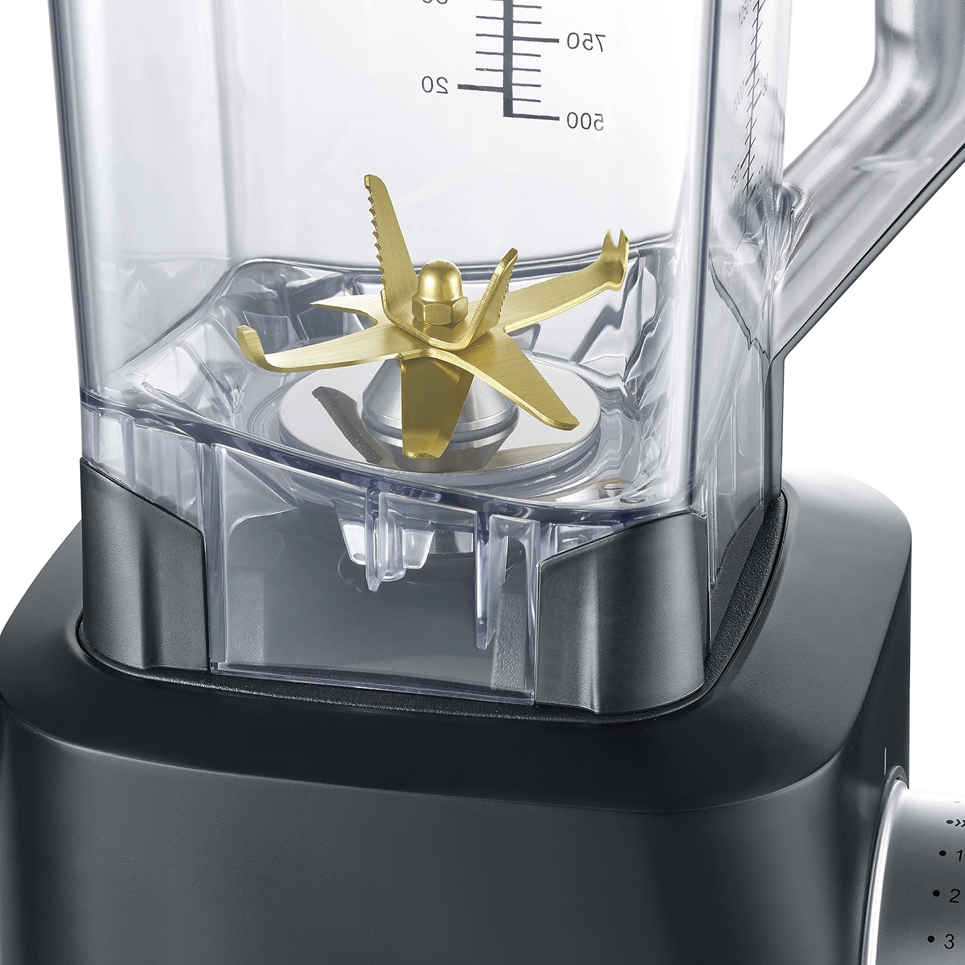 Close-up of a blender with golden blades and a measurement scale.