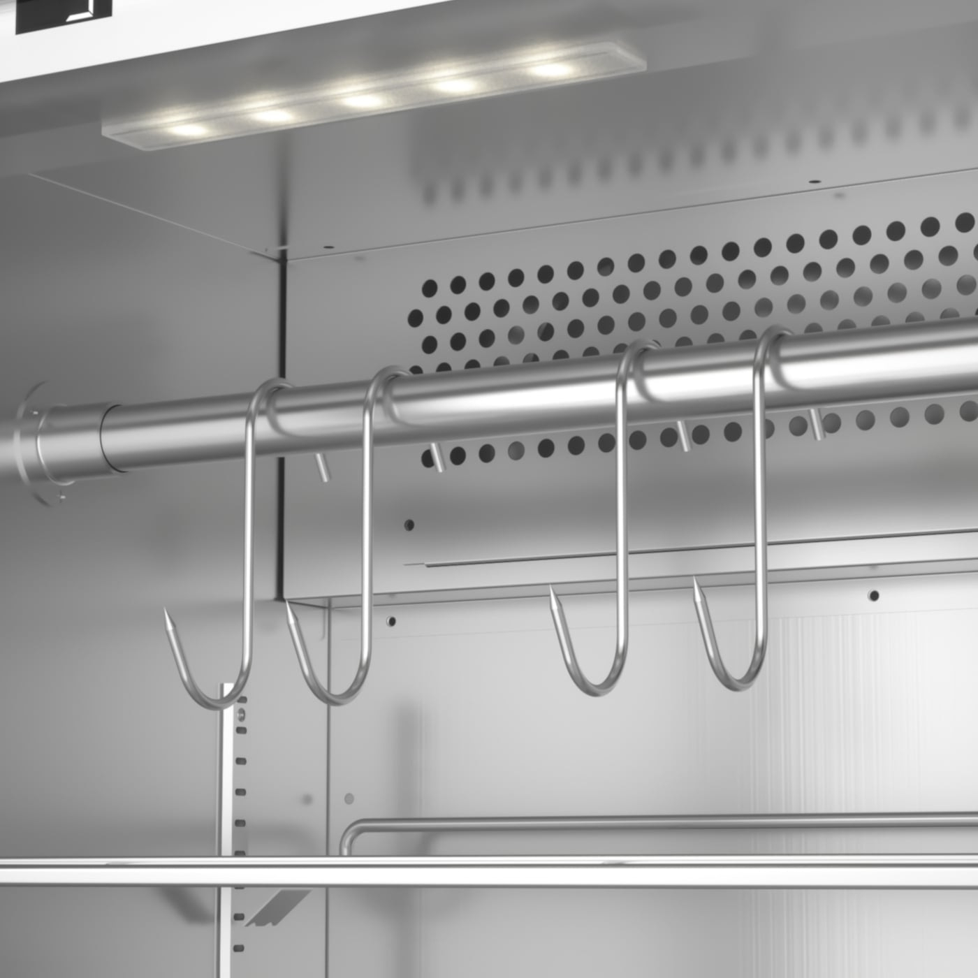 Meat hooks inside a refrigerator with lighting and ventilation holes