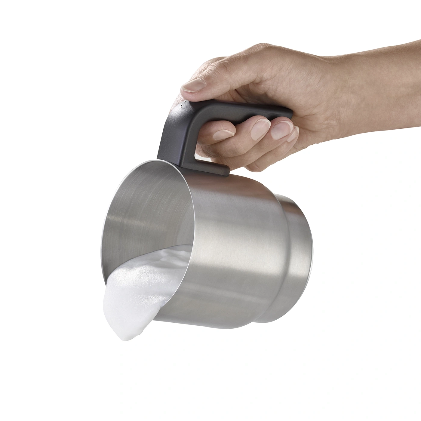 Hand holding milk frother, foam pouring out, stainless steel, isolated