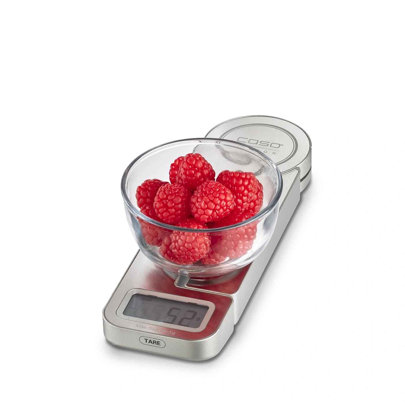 Himbeeren in einer Glasschüssel auf einer Waage, Nahaufnahme, isoliert