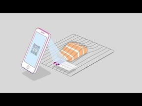 Smartphone scanning QR code on food packaging to get information about the food.