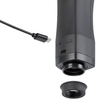 Schwarzes Gerät mit Kabel und abnehmbarem Ring, Nahaufnahme, isoliert