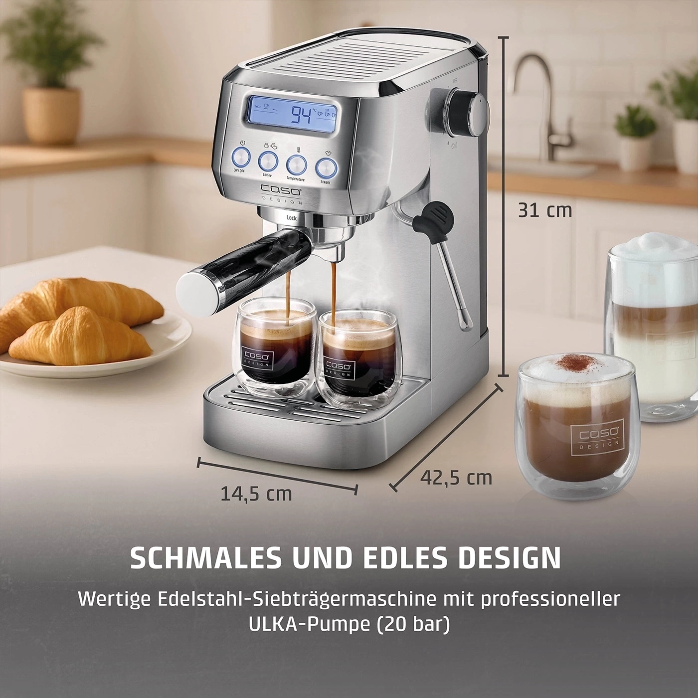 A silver espresso machine with two glasses of coffee and croissants next to it.