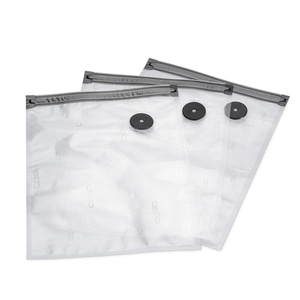 Three transparent vacuum bags with black valves and zippers, isolated on white.