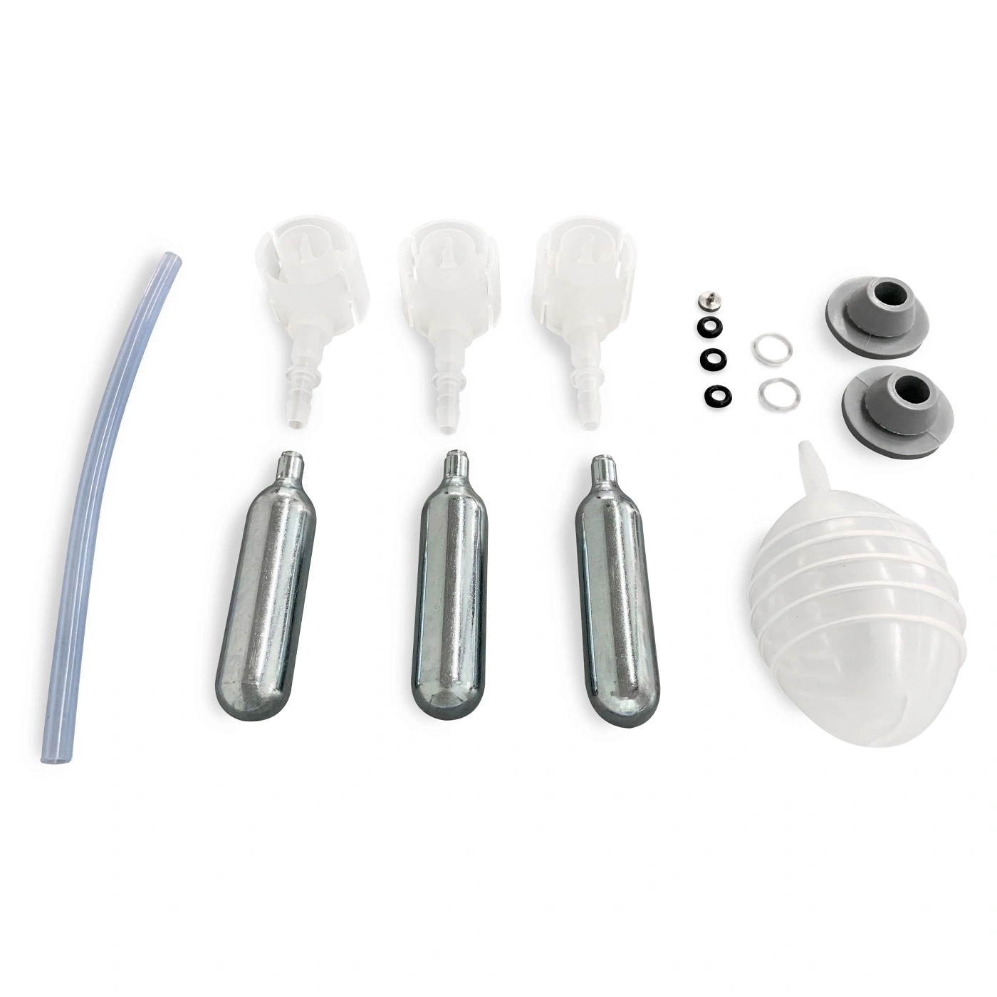 Various parts of a device, including cartridges, nozzles, and a tube, on white.