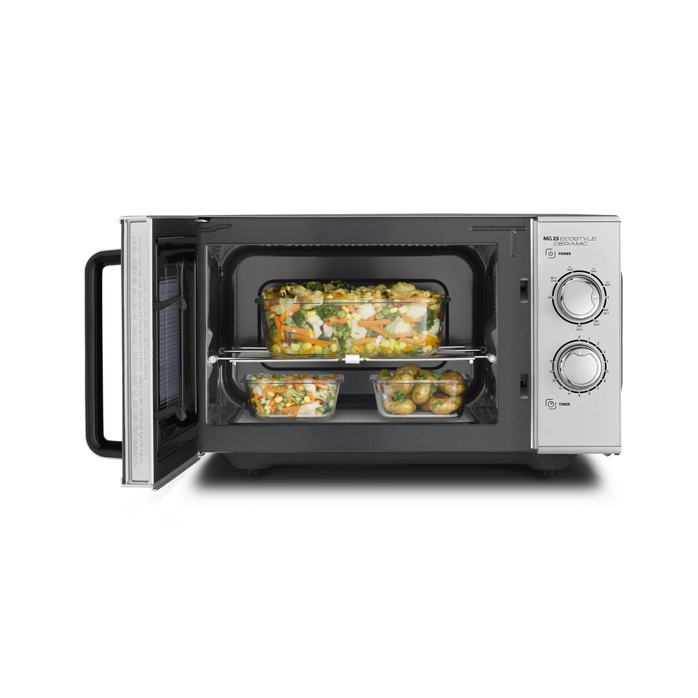 Mikrowelle mit Gemüse und Kartoffeln, geöffnet, bereit zum Kochen.