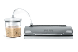 Vacuum sealer with container and hose filled with soup isolated on white background