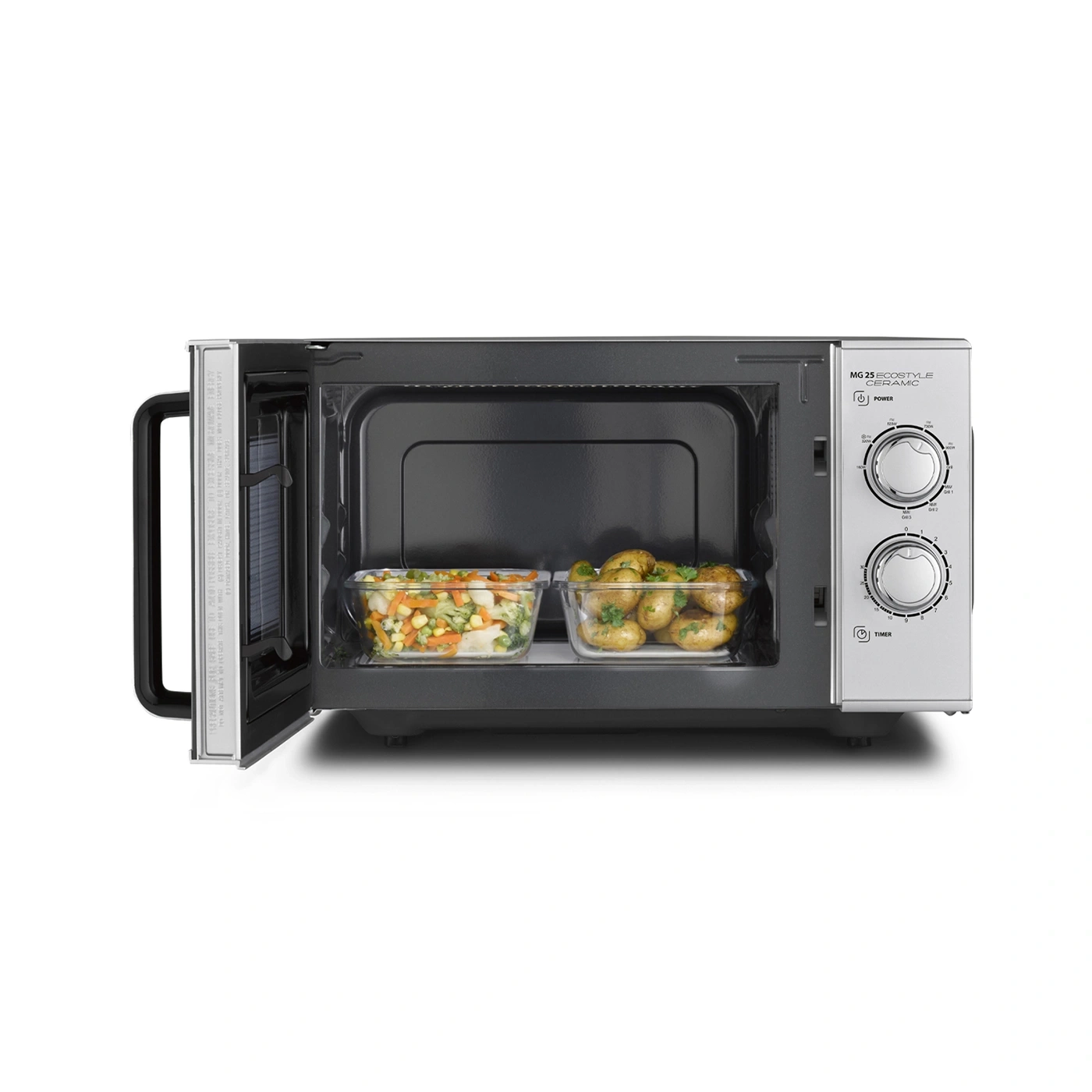Mikrowelle mit Gemüse und Kartoffeln, offen, bereit zum Kochen.
