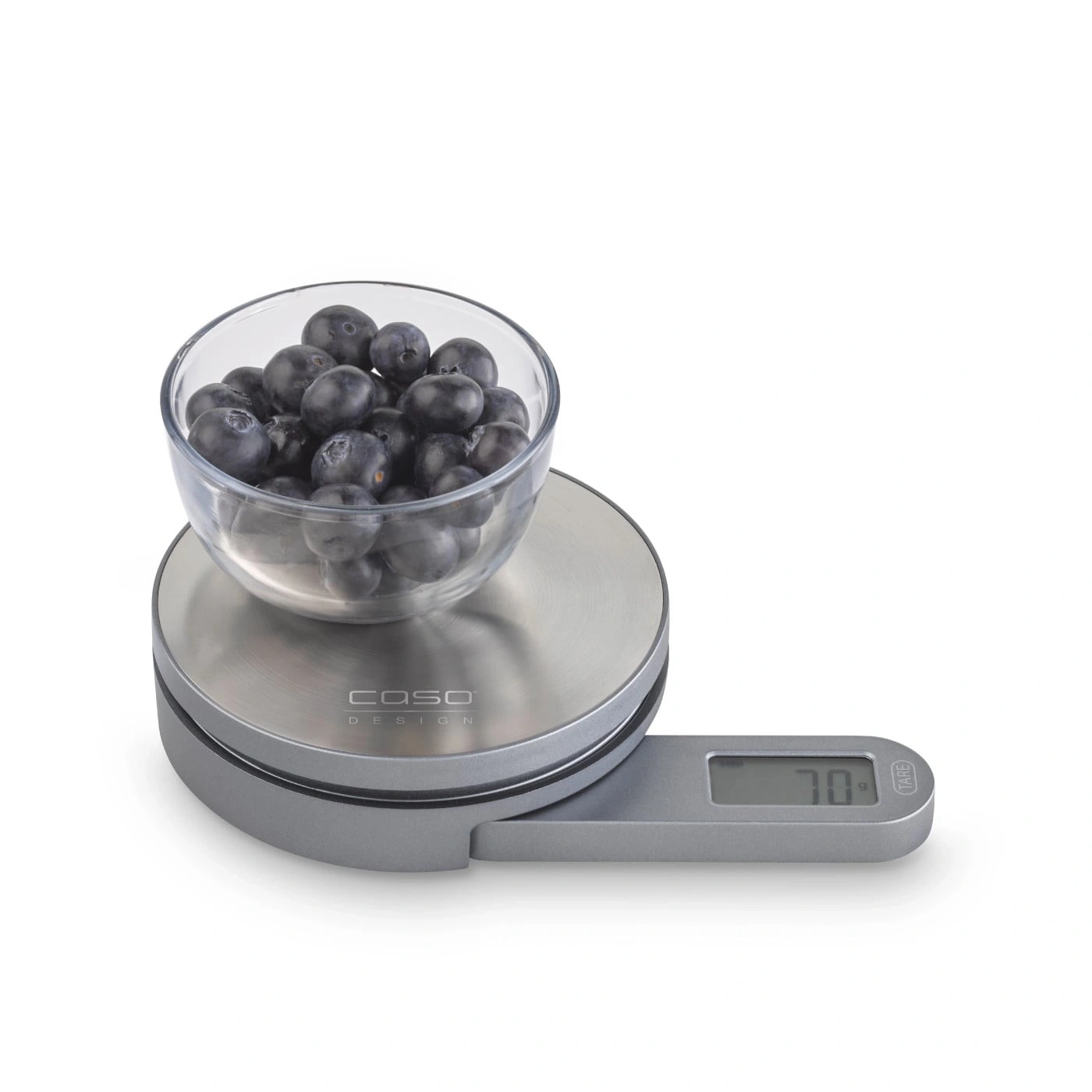 Blaubeeren in einer Glasschüssel auf einer Küchenwaage, 70g.